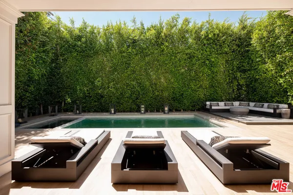 a view of swimming pool from a balcony