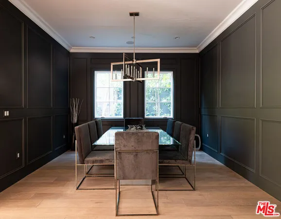 a view of a room with furniture and wooden floor