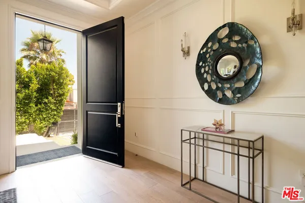 a view of entryway with wooden floor