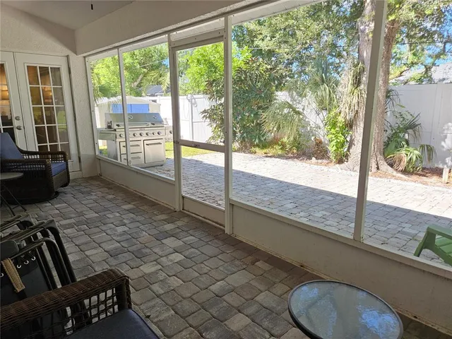 a view of a floor to ceiling window and wooden floor