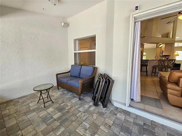 a view of a livingroom with furniture and a window