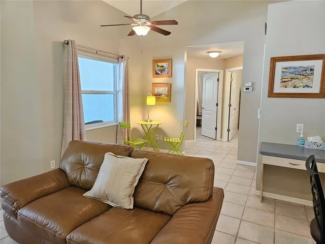 a living room with furniture and a window