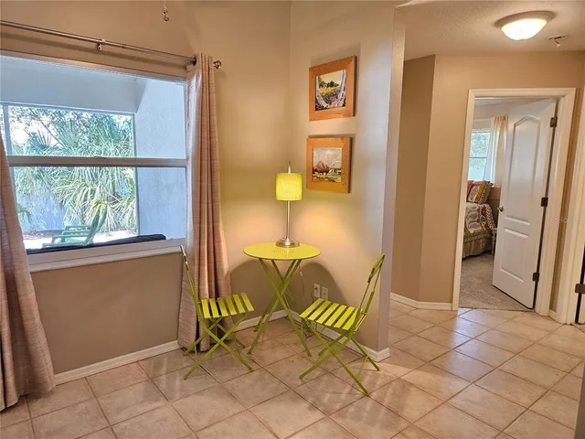 a view of a room with a table and a chair