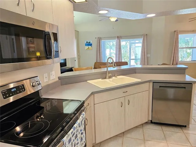 a kitchen with a stove and a sink