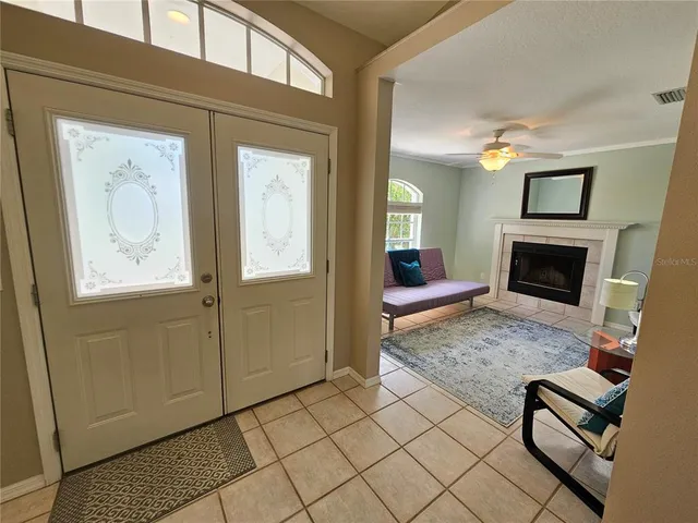 a living room with furniture and a fireplace