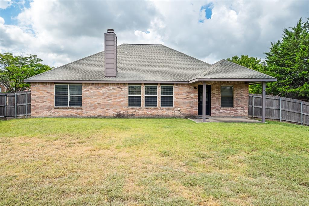 206 Ridge View Court Decatur, TX 76234 - Photo 25 of 29 a front view of a house with garden