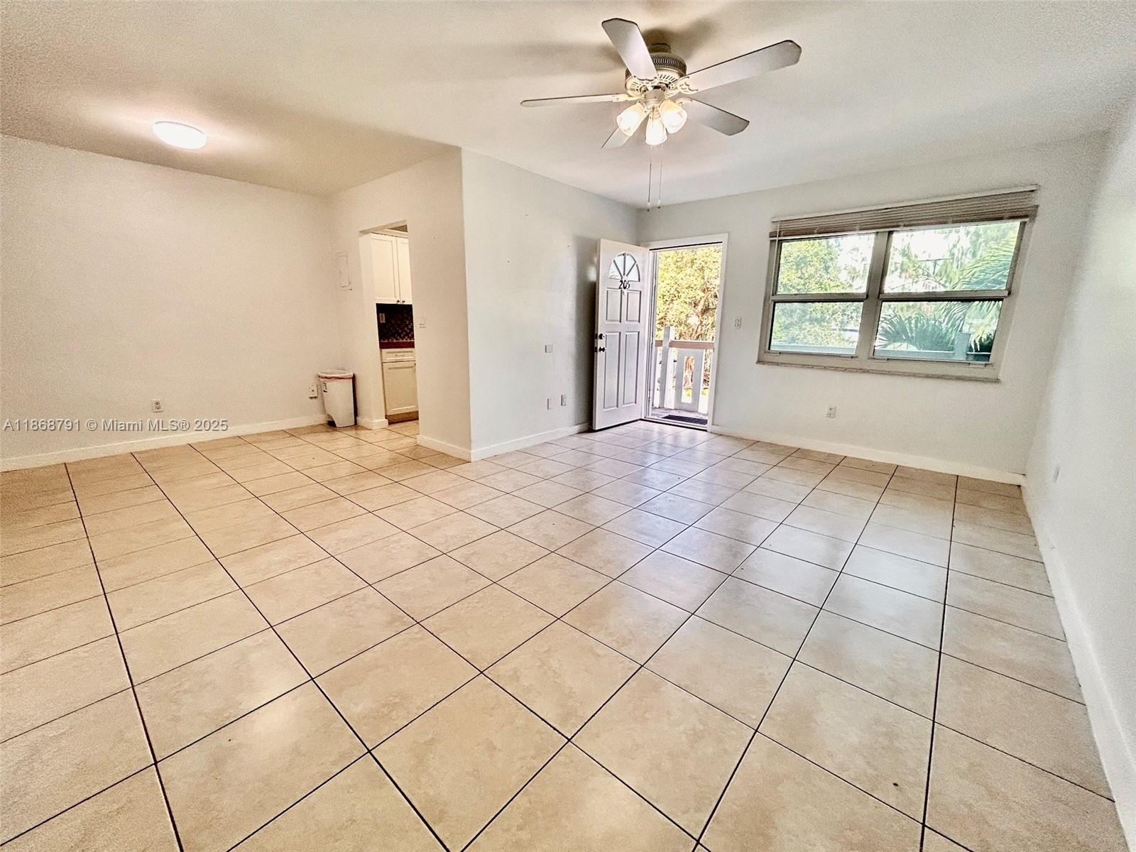 3265 Griffin Road, Unit 205 Dania Beach, FL 33312 - Photo 5 of 13 a view of an empty room and window