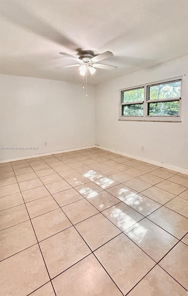 3265 Griffin Road, Unit 205 Dania Beach, FL 33312 - Photo 9 of 13 a view of an empty room and window