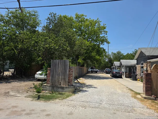 a view of backyard with sitting area