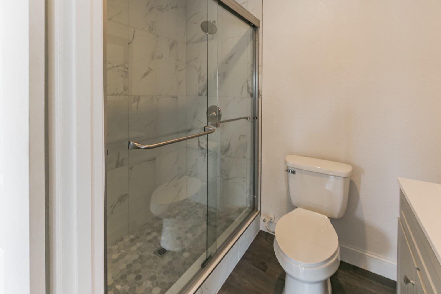 441 Debra Lane Ridgecrest, CA 93555 - Photo 12 of 30 a bathroom with a toilet and a shower