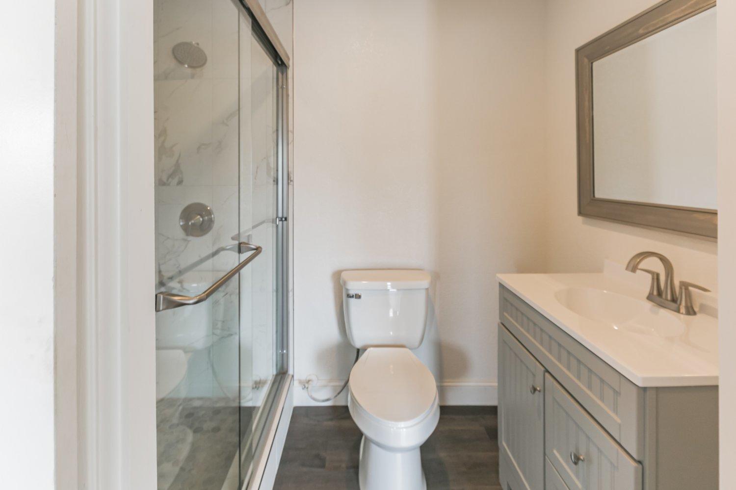 441 Debra Lane Ridgecrest, CA 93555 - Photo 13 of 30 a bathroom with a sink toilet and shower