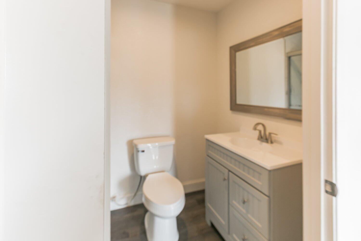 441 Debra Lane Ridgecrest, CA 93555 - Photo 14 of 30 a bathroom with a sink toilet and mirror