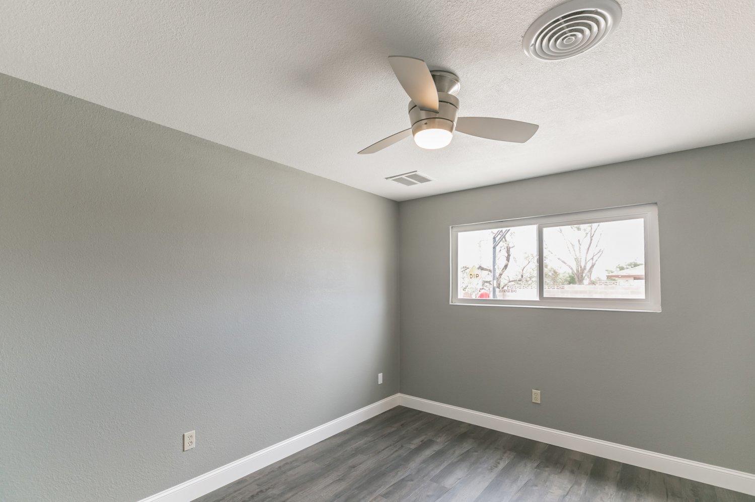 441 Debra Lane Ridgecrest, CA 93555 - Photo 18 of 30 an empty room with a window and ceiling fan