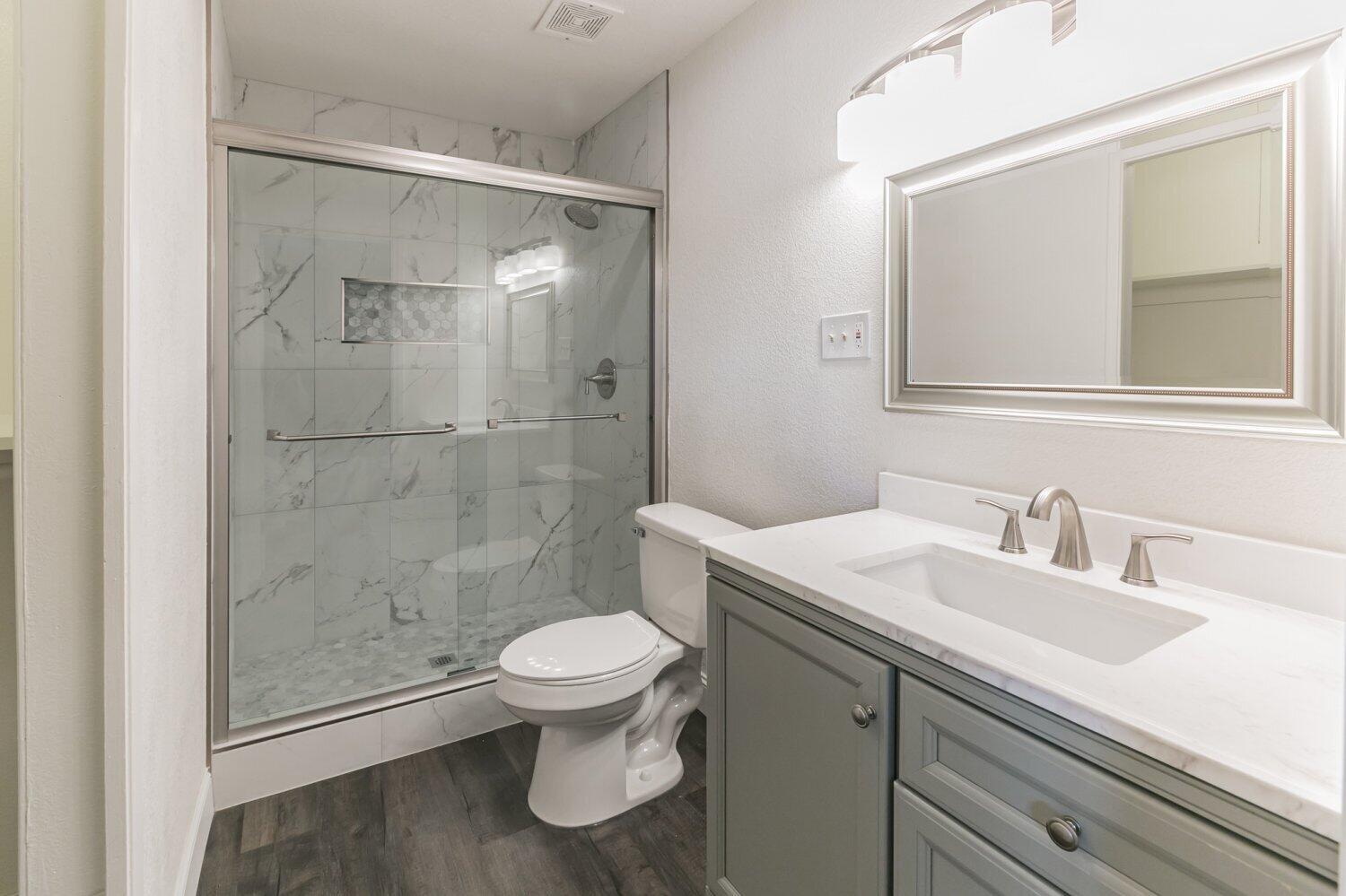 441 Debra Lane Ridgecrest, CA 93555 - Photo 25 of 30 a bathroom with a sink a toilet and shower