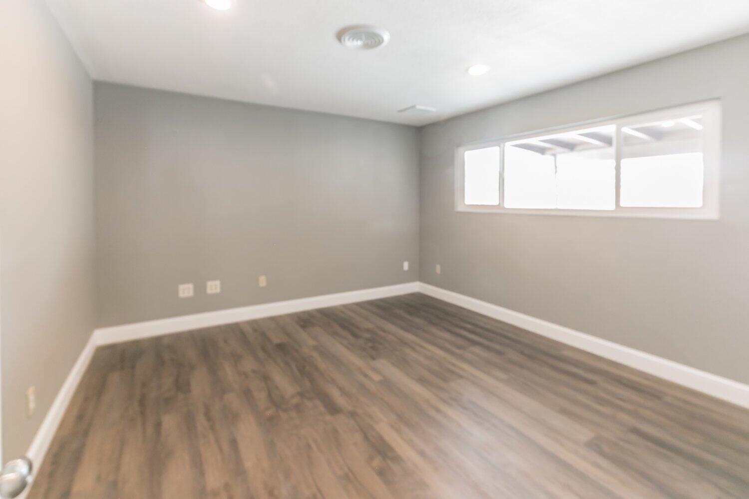 441 Debra Lane Ridgecrest, CA 93555 - Photo 26 of 30 wooden floor in an empty room with a window