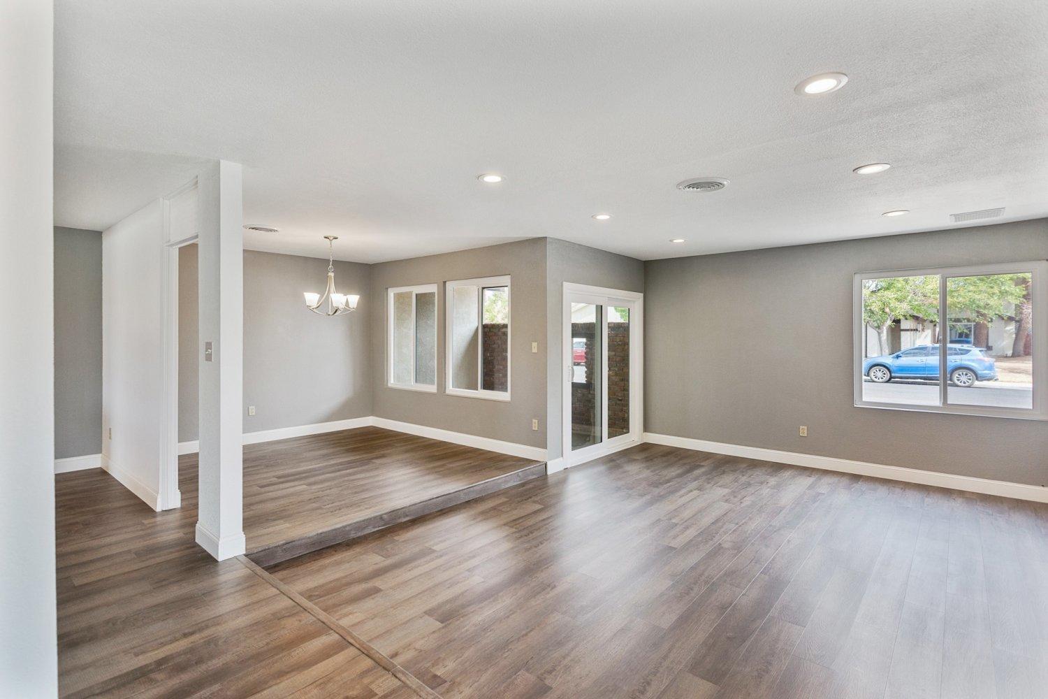 441 Debra Lane Ridgecrest, CA 93555 - Photo 28 of 30 an empty room with wooden floor and windows