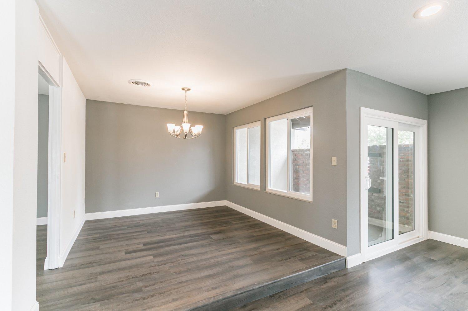 441 Debra Lane Ridgecrest, CA 93555 - Photo 7 of 30 an empty room with wooden floor and windows