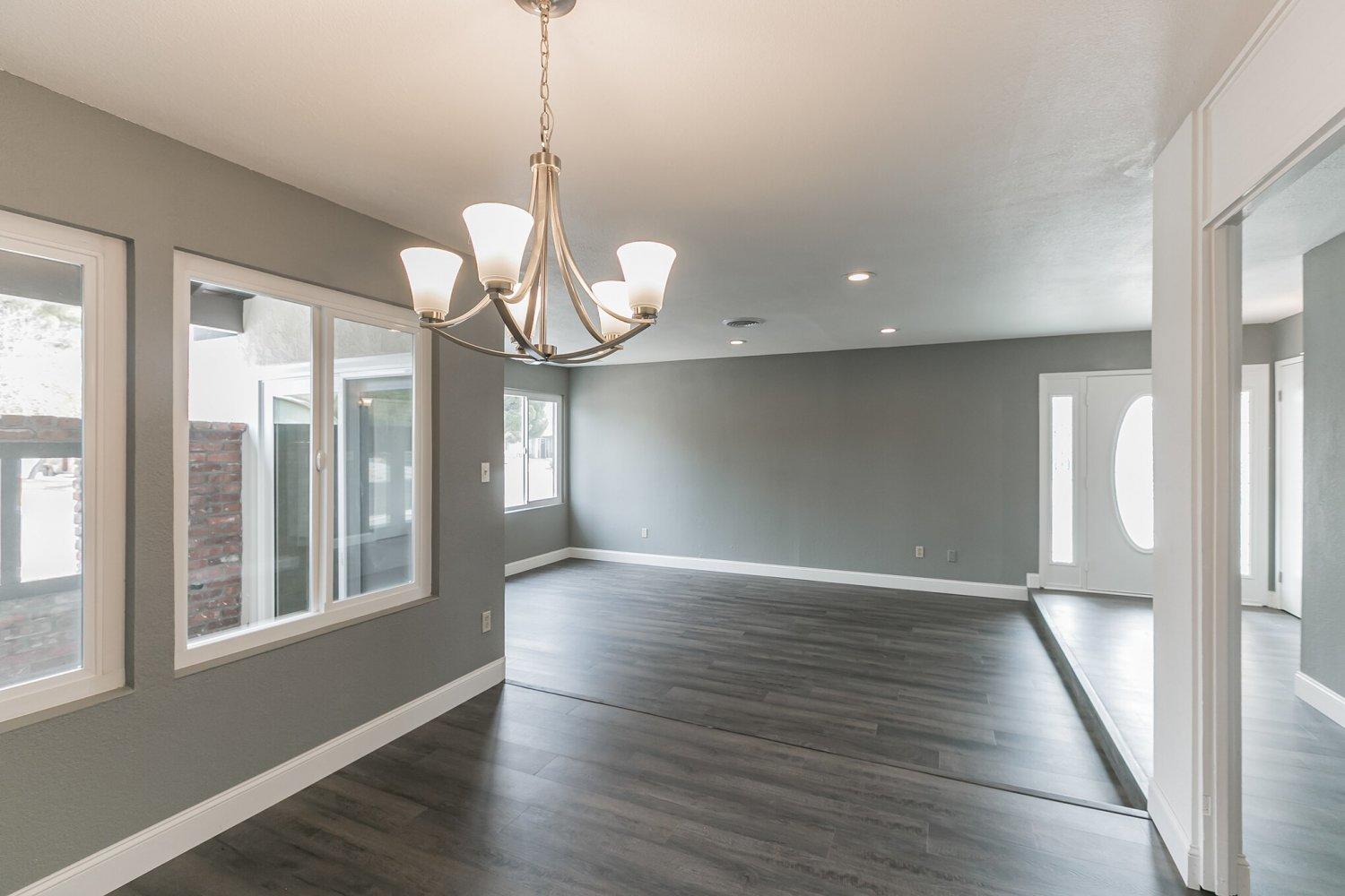 441 Debra Lane Ridgecrest, CA 93555 - Photo 8 of 30 a view of an empty room with wooden floor and windows