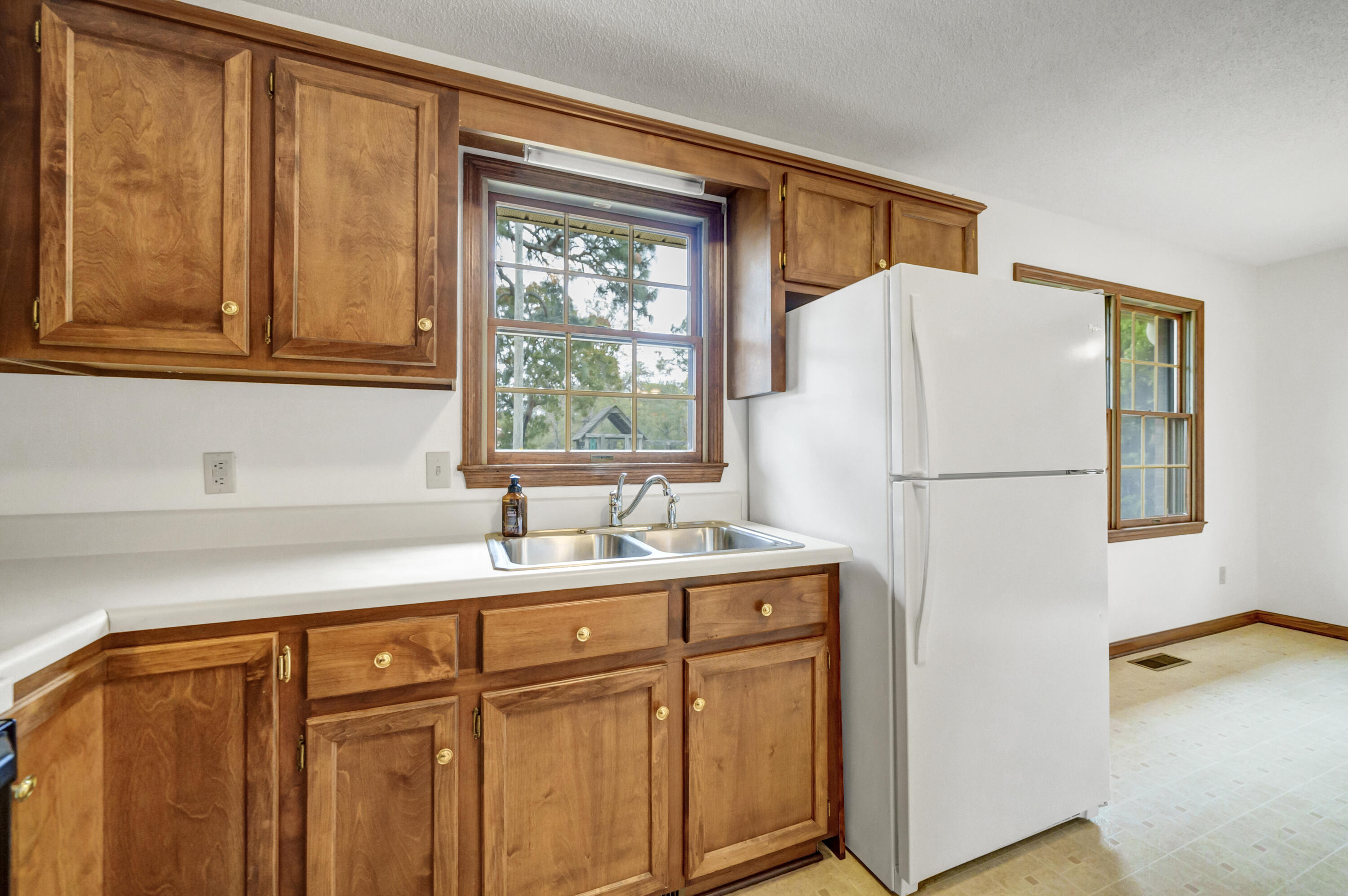 5255 Two Notch Road Leesville, SC 29070 - Photo 7 of 52 a white refrigerator freezer sitting in a kitchen