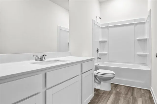 a bathroom with a sink a toilet and a bathtub