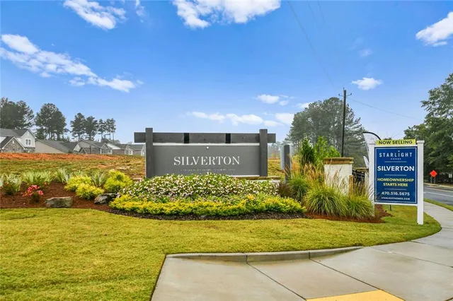a view of a water fountain in front of house