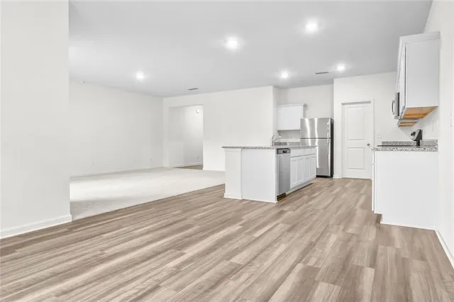 a view of kitchen with wooden floor
