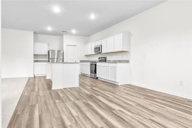 a view of kitchen with wooden floor
