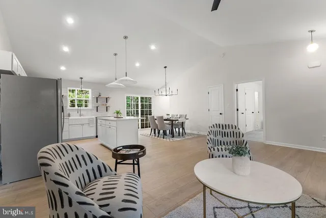 a dining room with furniture and wooden floor