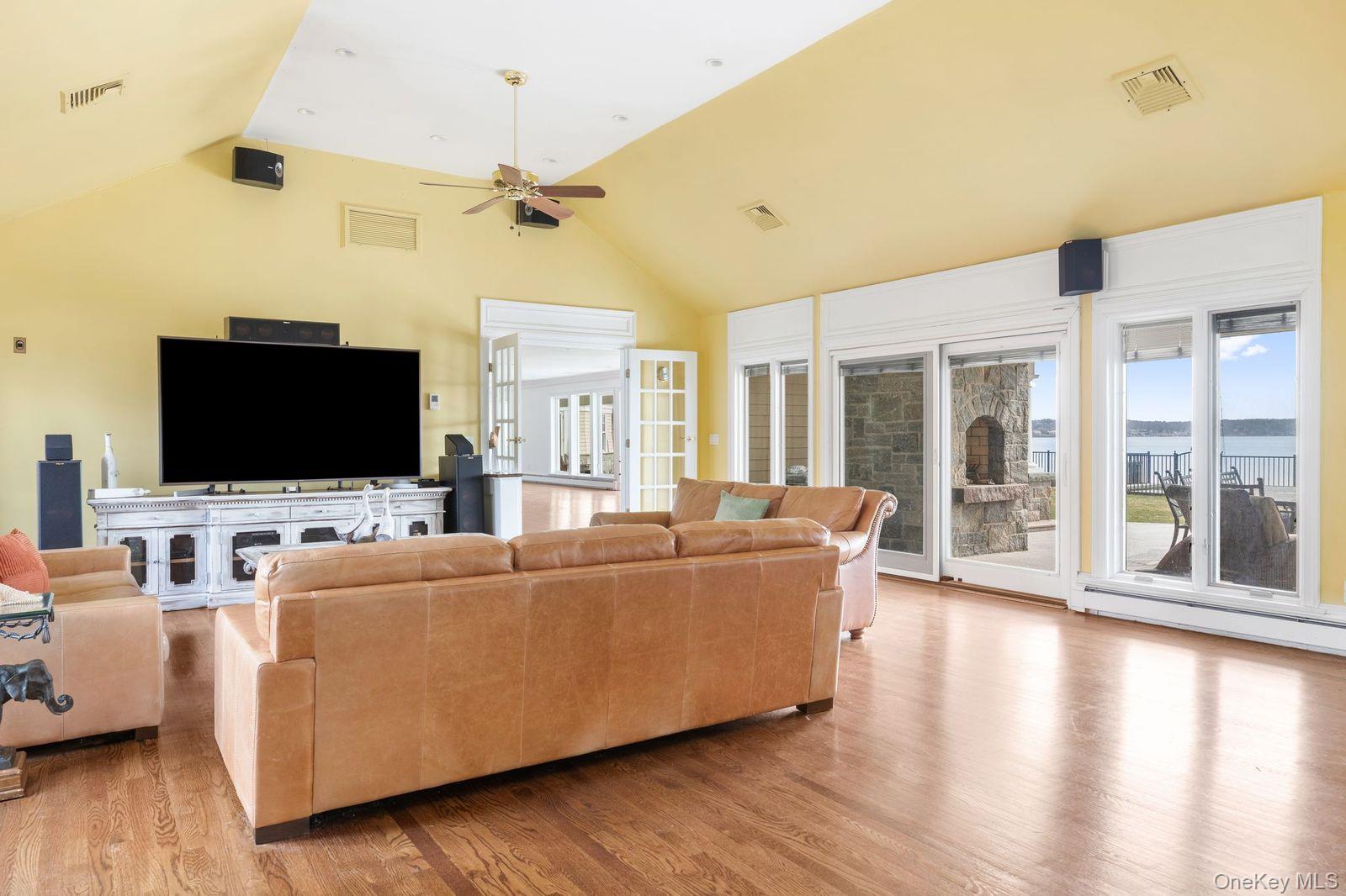33 Beach Road Northport, NY 11768 - Photo 11 of 50 a living room with furniture and a flat screen tv