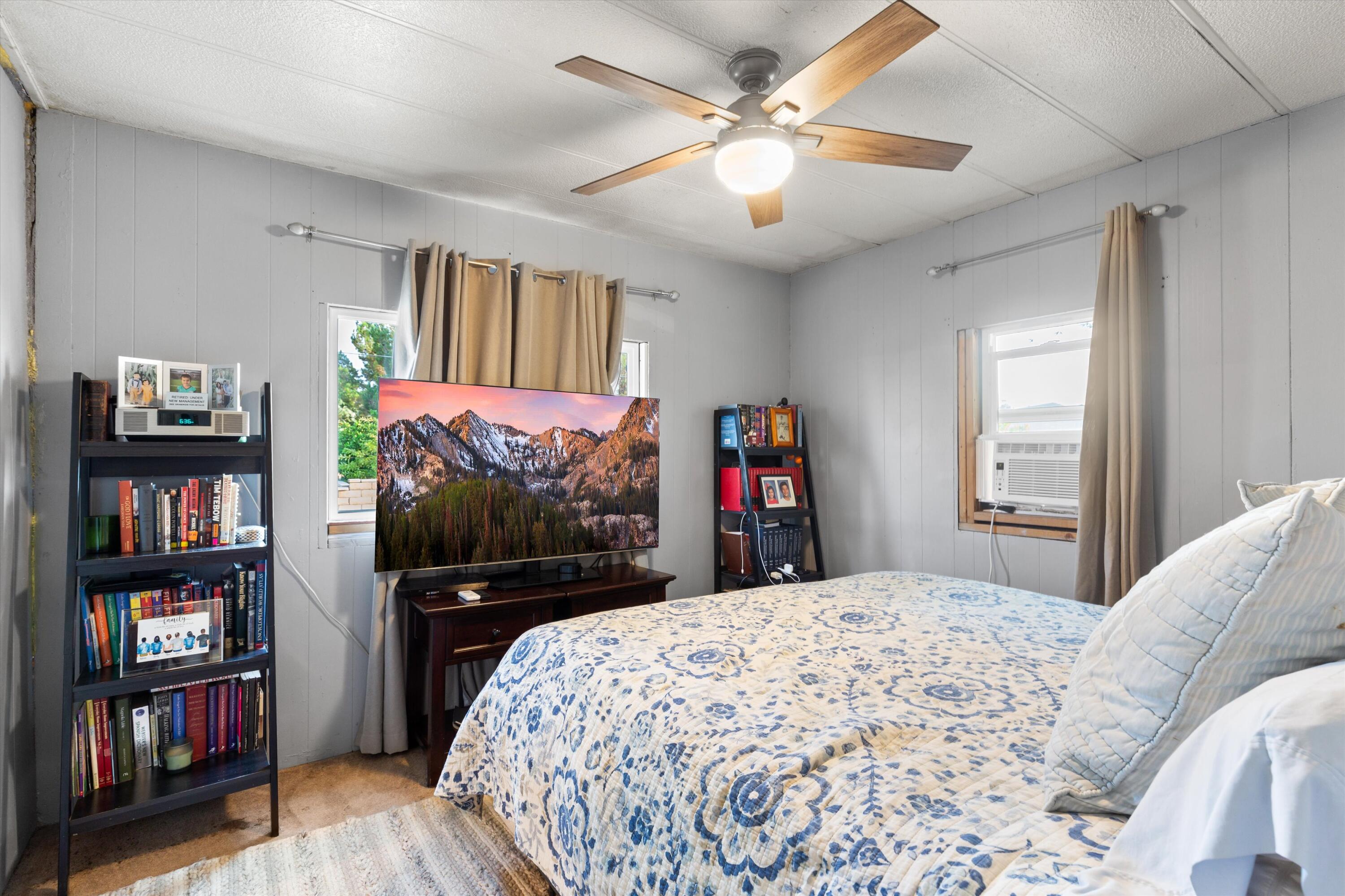 36990 Dune Palms Road Indio, CA 92203 - Photo 12 of 30 a bedroom with a bed and a flat screen tv