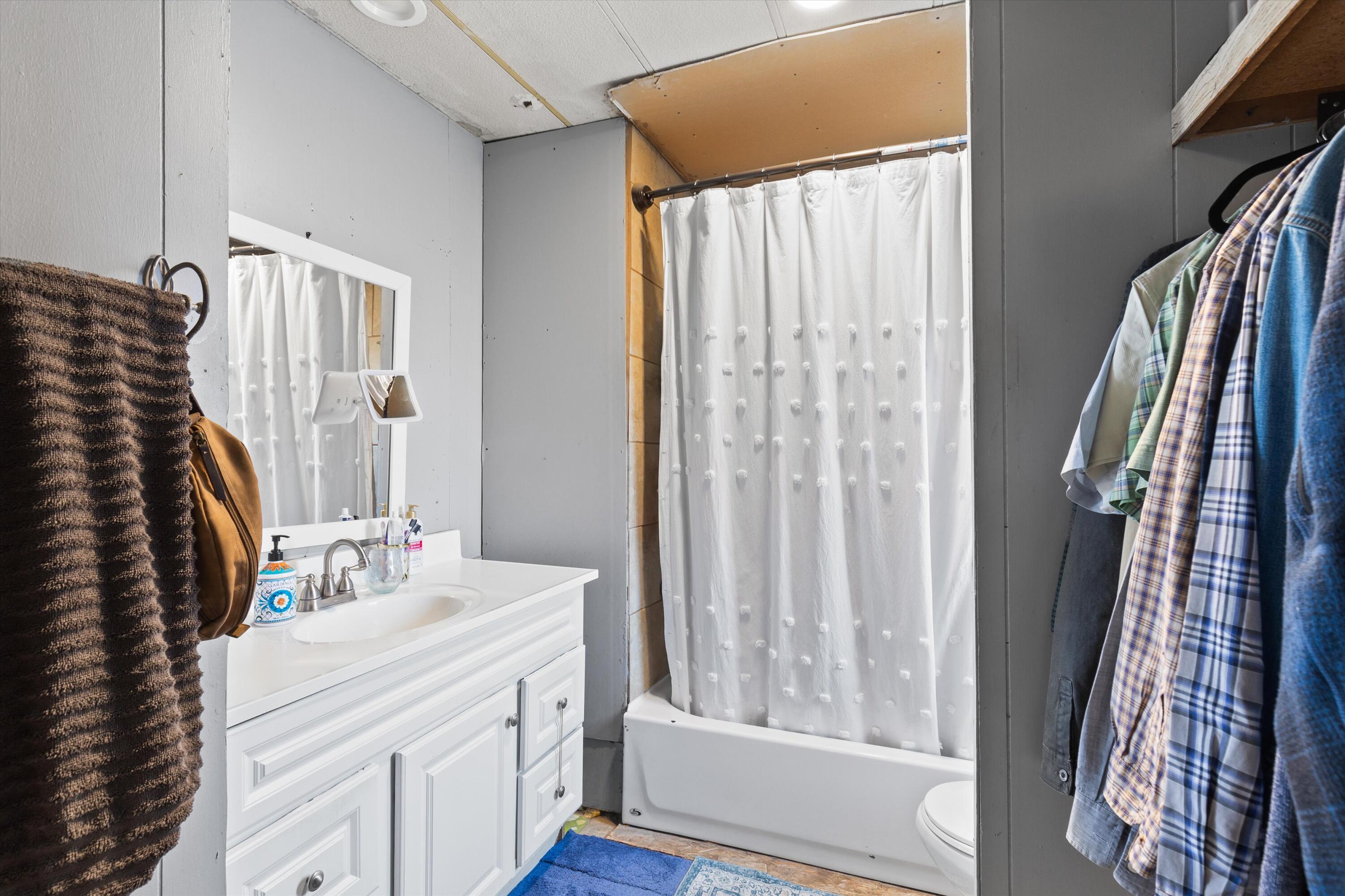 36990 Dune Palms Road Indio, CA 92203 - Photo 14 of 30 a bathroom with a sink a mirror and a shower