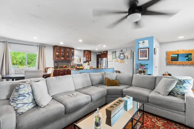 a living room with furniture and a large window