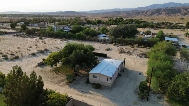 an aerial view of a house with a garden