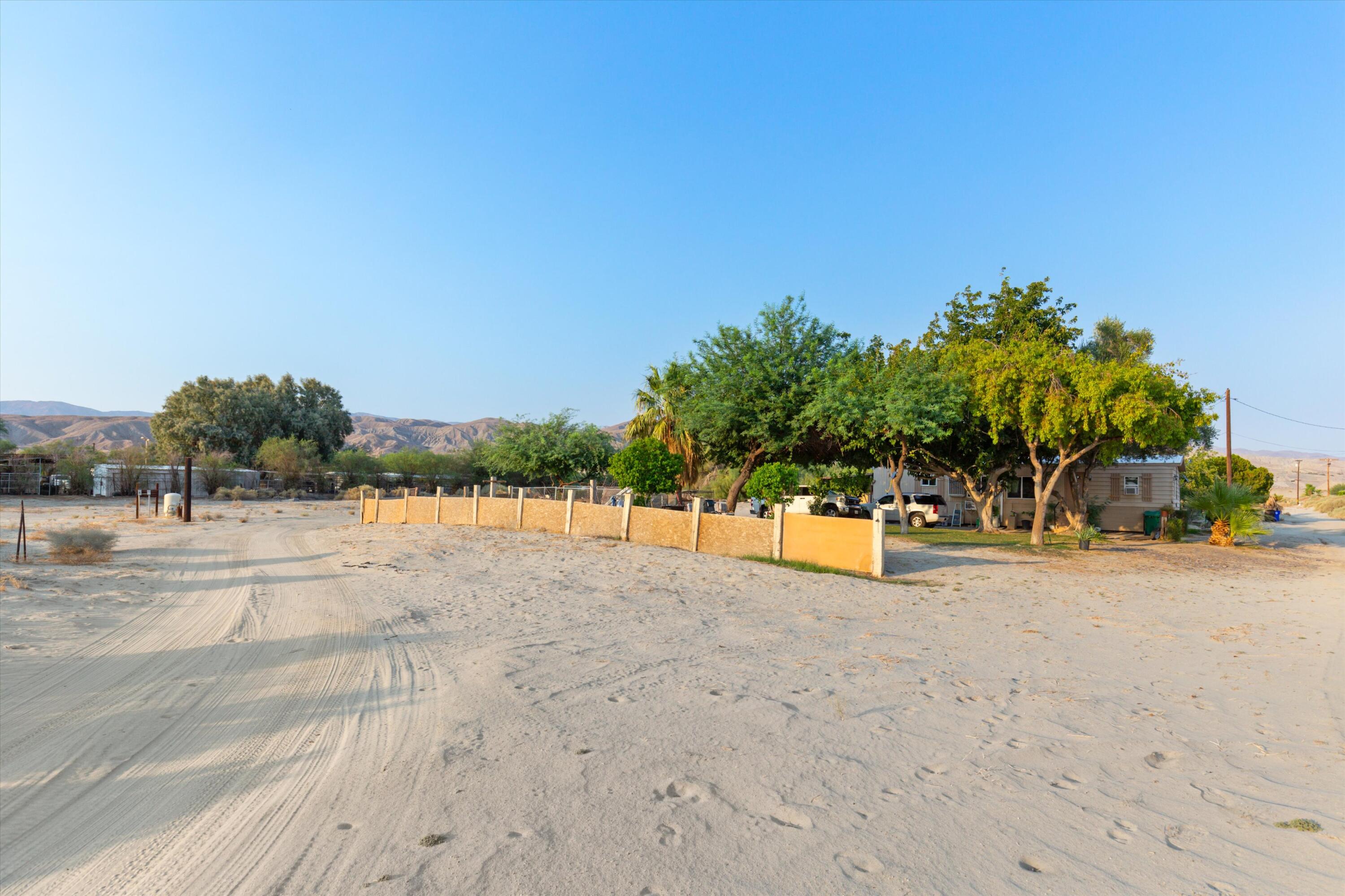 36990 Dune Palms Road Indio, CA 92203 - Photo 26 of 30 a view of a house with a yard and potted plants