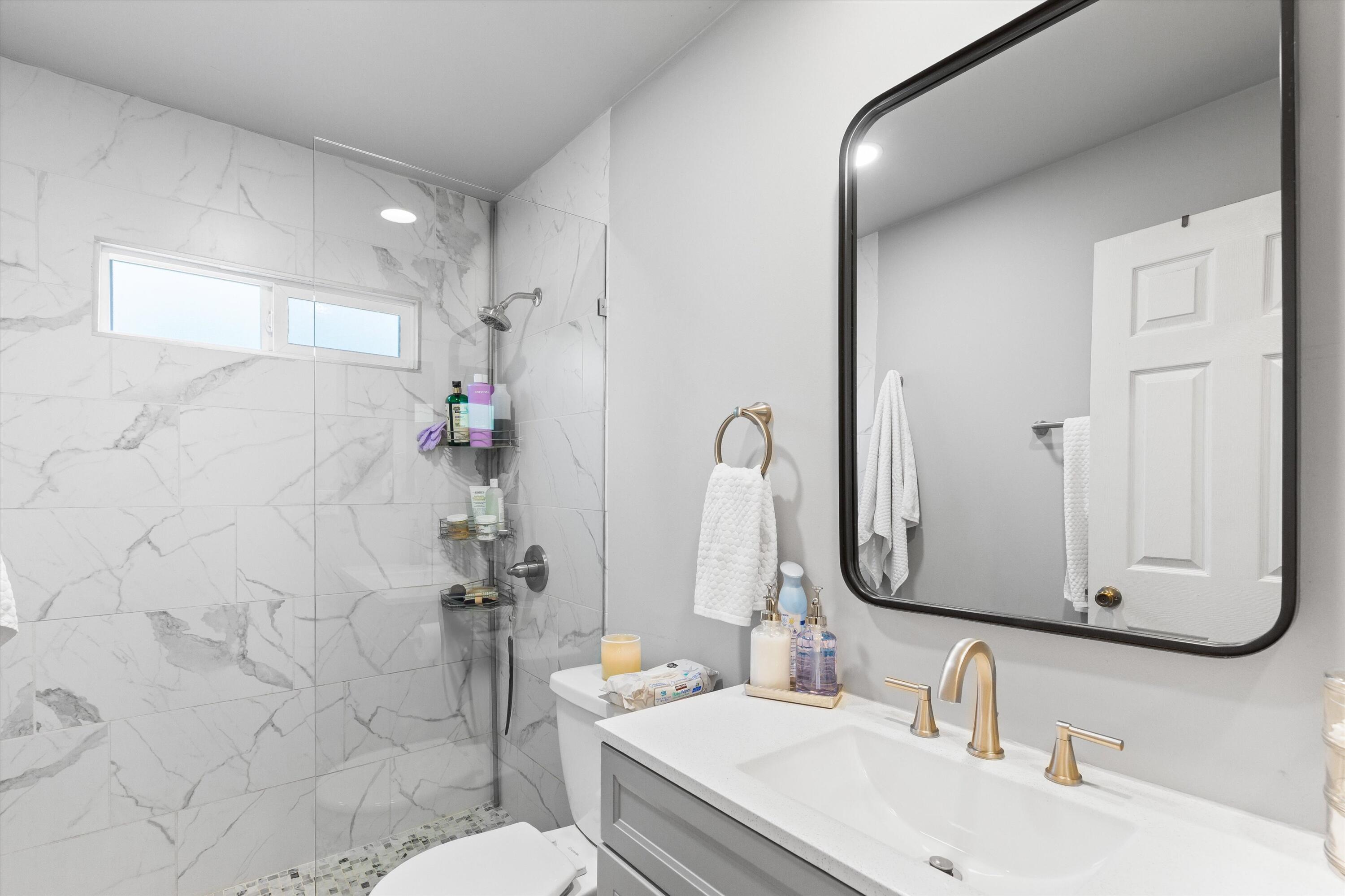 36990 Dune Palms Road Indio, CA 92203 - Photo 9 of 30 a bathroom with a sink vanity mirror and toilet