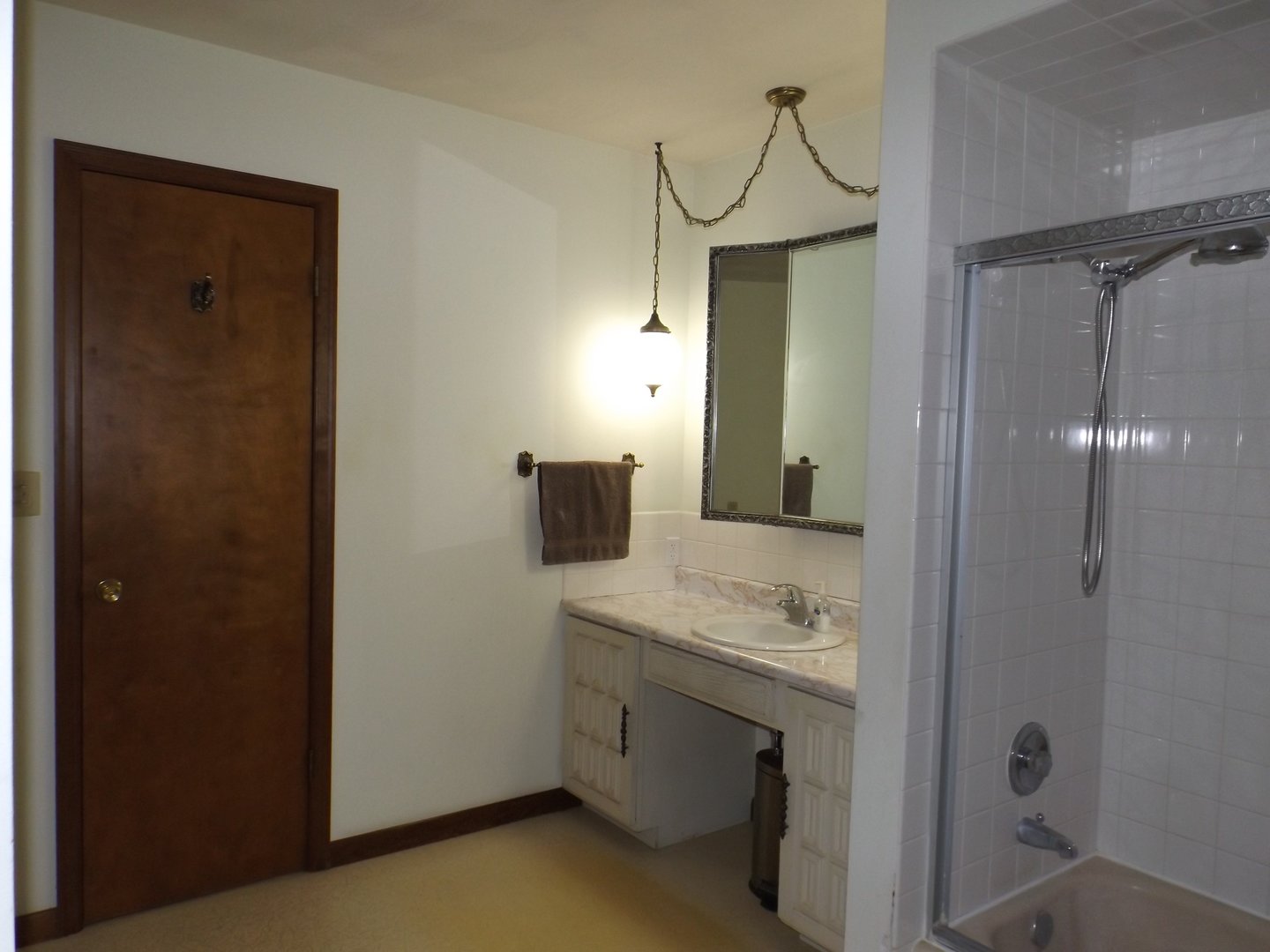 1804 Kelly Road Rock Falls, IL 61071 - Photo 14 of 26 a bathroom with a granite countertop sink a mirror and shower