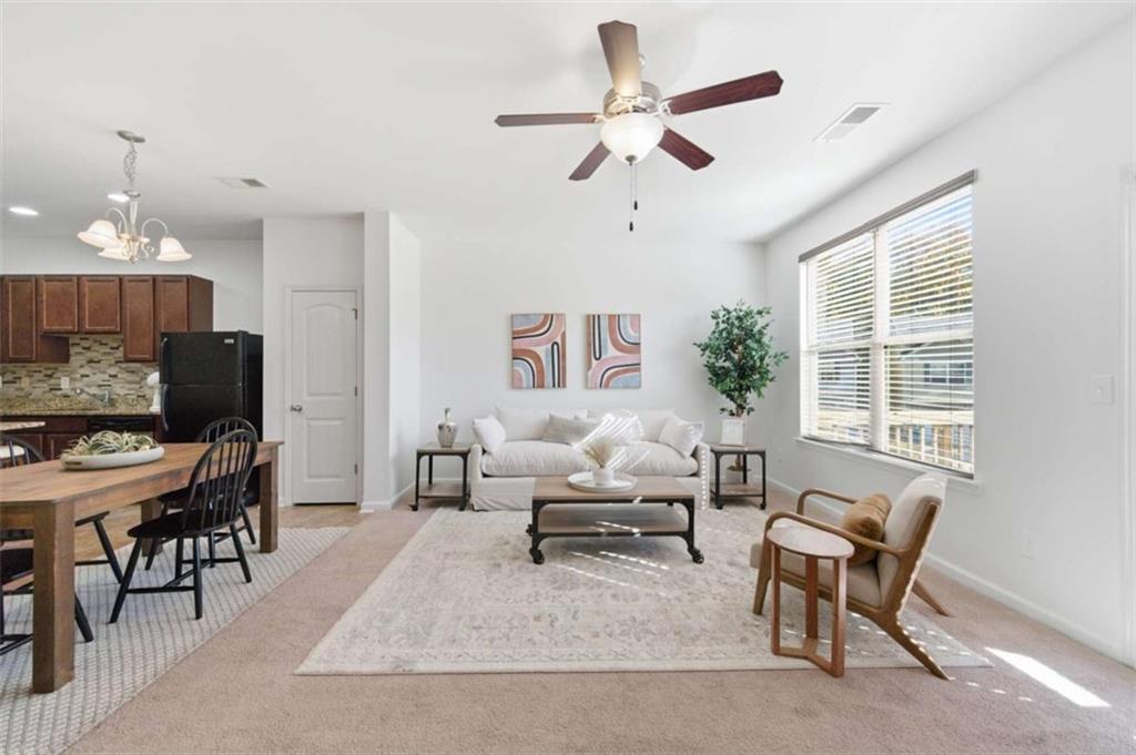 6872 Zaniah Road South Fulton, GA 30331 - Photo 11 of 29 a living room with furniture and a large window