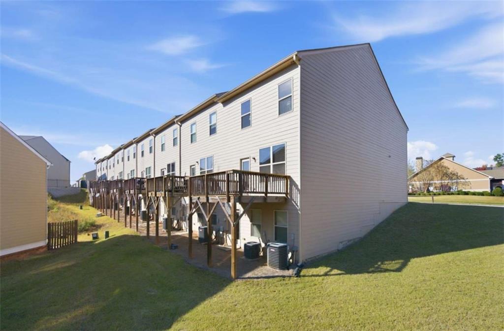 6872 Zaniah Road South Fulton, GA 30331 - Photo 25 of 29 a view of wooden house with a yard