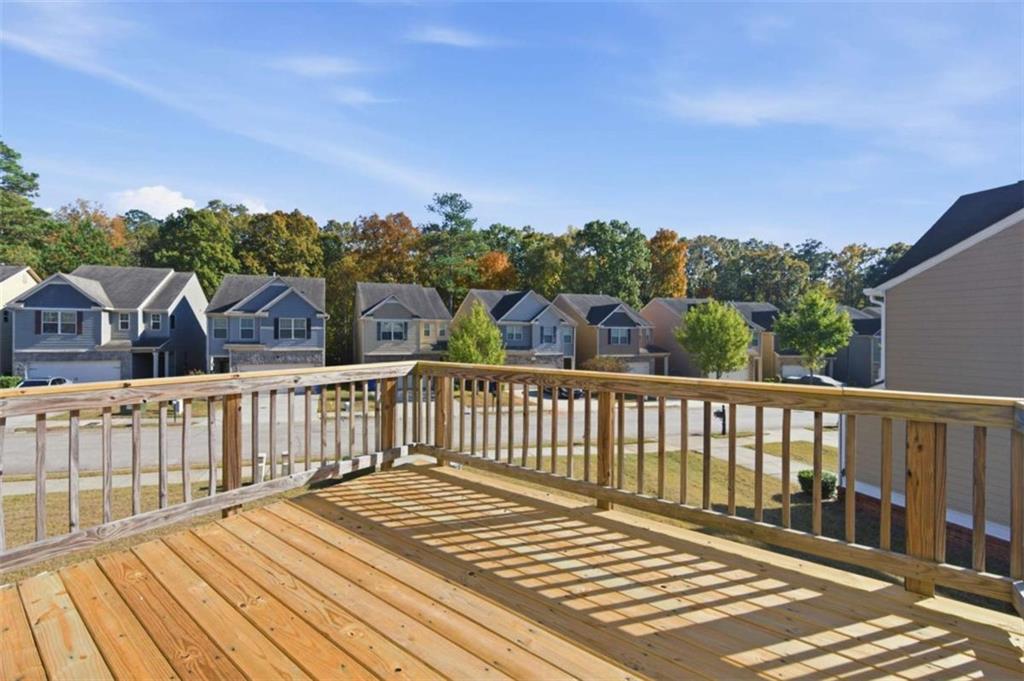 6872 Zaniah Road South Fulton, GA 30331 - Photo 26 of 29 a view of a wooden roof with wooden floor and city view