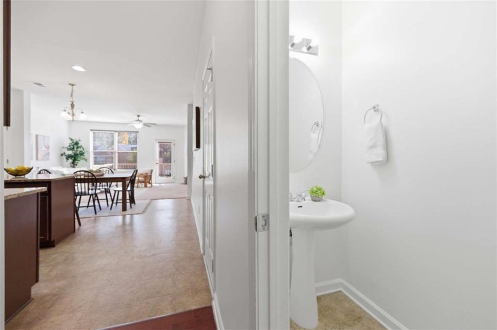 6872 Zaniah Road South Fulton, GA 30331 - Photo 3 of 29 a hallway with dining table and chairs