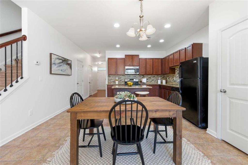 6872 Zaniah Road South Fulton, GA 30331 - Photo 6 of 29 a view of a dining room with furniture