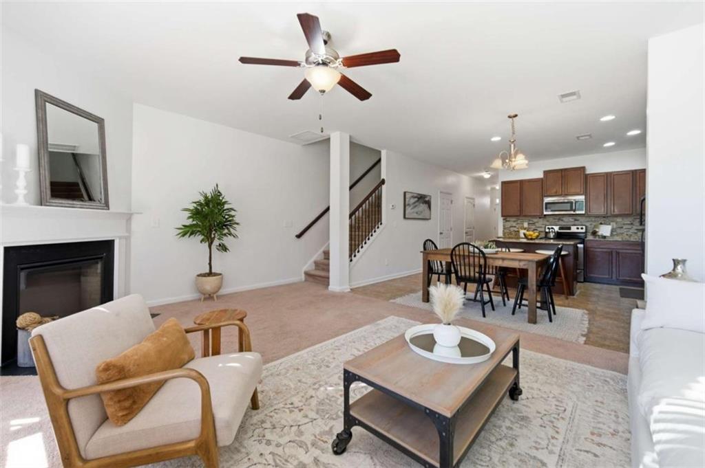 6872 Zaniah Road South Fulton, GA 30331 - Photo 9 of 29 a living room with furniture and kitchen view