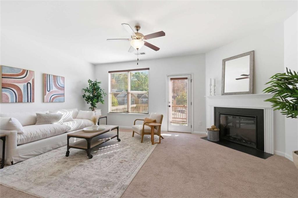 6872 Zaniah Road South Fulton, GA 30331 - Photo 10 of 29 a living room with furniture and a fireplace