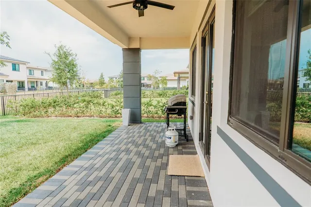 a porch with view of outdoor space with seating area