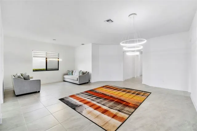 a living room with furniture and a rug