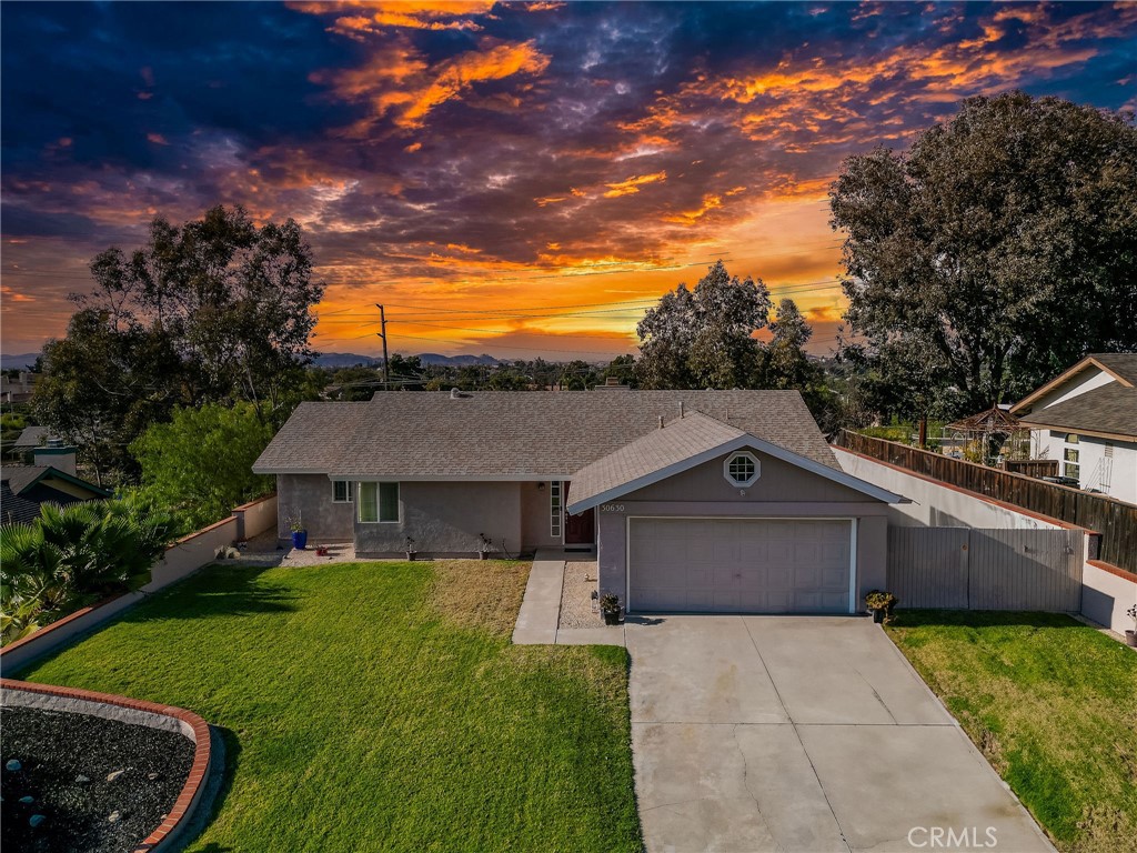 View of Front of Home with Beautiful Sunset