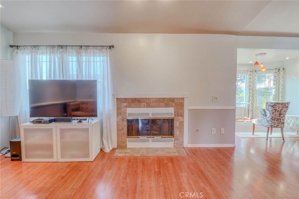 30630 Southern Cross Road Temecula, CA 92592 - Photo 11 of 42 a living room with a flat screen tv and a fireplace