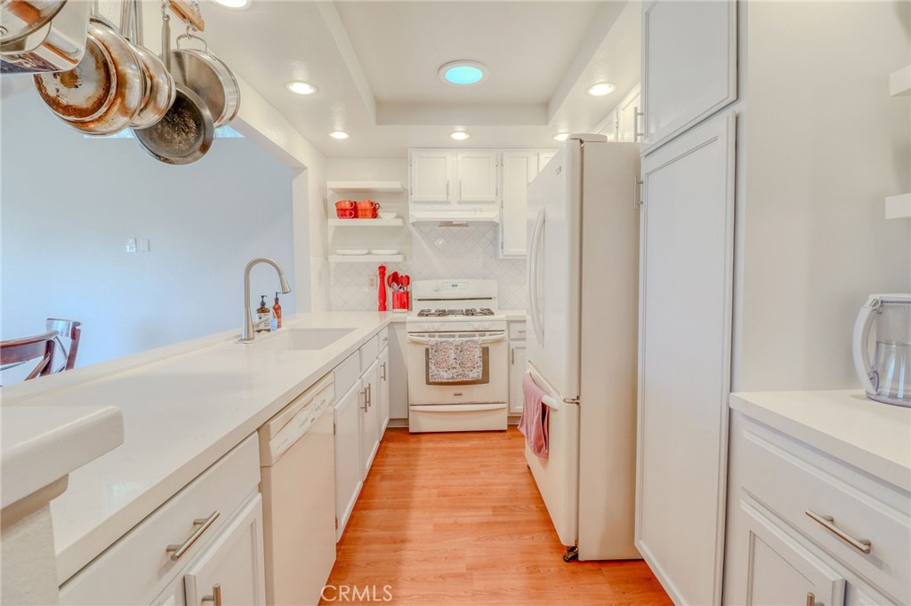 30630 Southern Cross Road Temecula, CA 92592 - Photo 13 of 42 a bathroom with a sink and a refrigerator