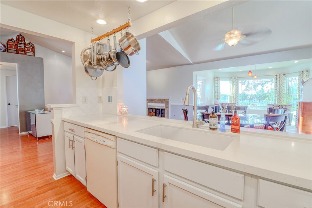 30630 Southern Cross Road Temecula, CA 92592 - Photo 16 of 42 a kitchen with a sink and cabinets