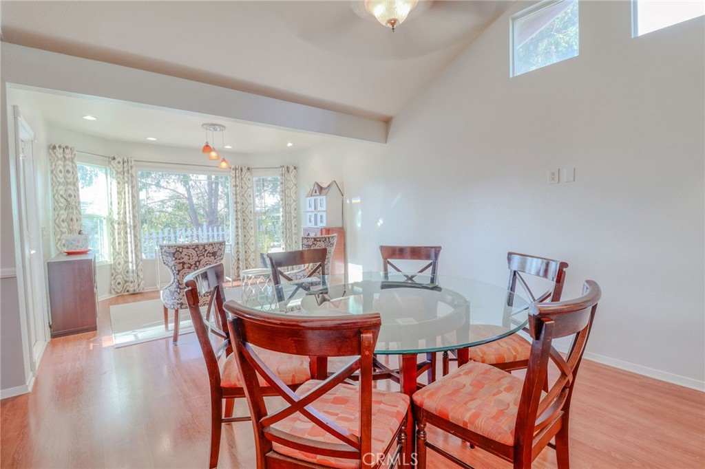 30630 Southern Cross Road Temecula, CA 92592 - Photo 18 of 42 a dining room with furniture and wooden floor